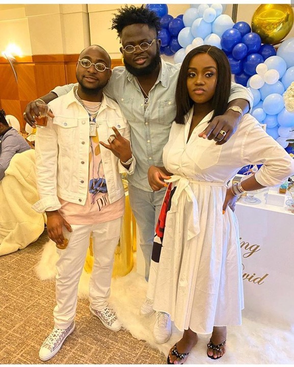 From Left: Davido, a guest and Chioma at the naming ceremony. (myjoyonline)