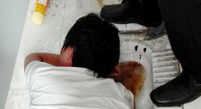 Man gets arm stuck in a filthy toilet public toilet while trying to retrieve new smartphone