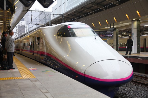 Travelers board Shinkansen Hayate train