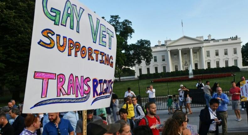 Protesters gather in front of the White House in Washington, DC in July against President Donald Trump's plan to ban transgender people from serving in the military