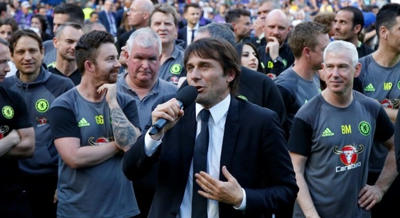 Chelsea's head coach Antonio Conte (C) talks during the presentation ceremony for the English Premier League trophy on May 21, 2017