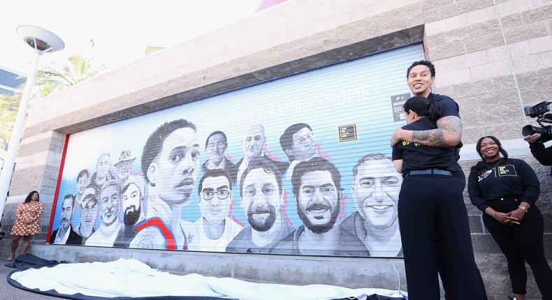 Brittney Griner hugs Neda Sharghi following the unveiling of the Bring Our Families Home mural outside of Phoenix's Footprint Center.Christian Petersen/Getty Images