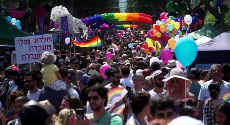 Men and women in colourful costumes, including several dressed as samba dancers, paraded through the streets on motorised floats or sashayed alongside