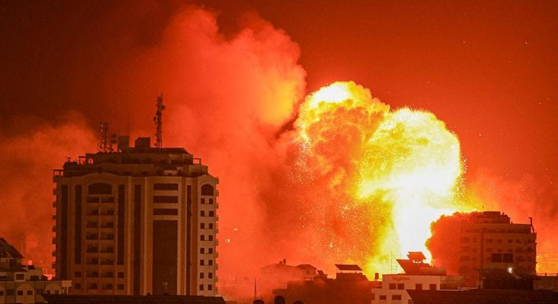 A fireball erupts from an Israeli airstrike in Gaza City on October 9, 2023. TMAHMUD HAMS/AFP via Getty Images