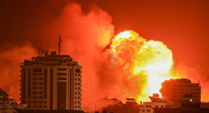 A fireball erupts from an Israeli airstrike in Gaza City on October 9, 2023. TMAHMUD HAMS/AFP via Getty Images