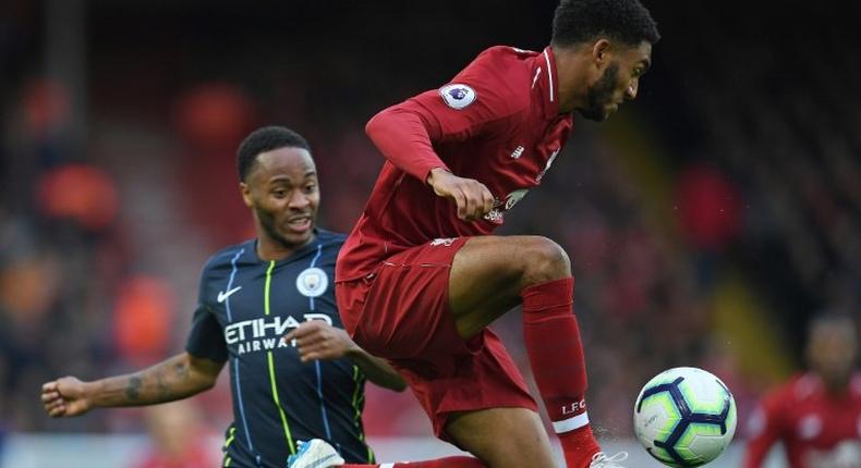 Liverpool defender Joe Gomez (right) faces a lengthy spell on the sidelines after a leg fracture