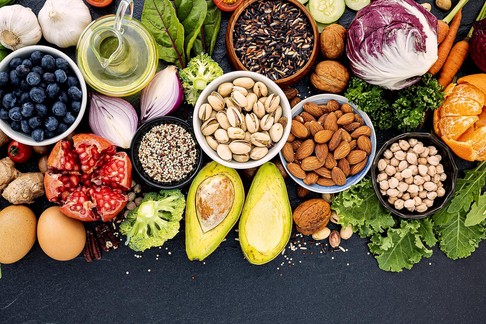 Ingredients for the healthy foods selection. The concept of healthy food set up on dark stone background.