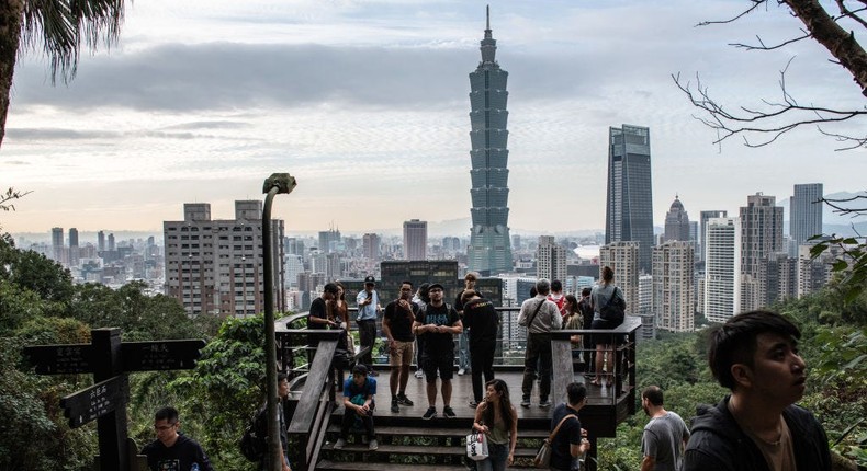 People enjoy the view of the Taipei 101 tower.Carl Court/Getty Images