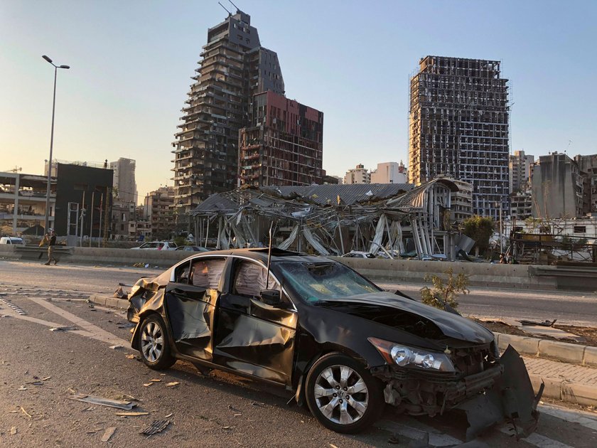 Damaged vehicle and buildings are pictured near the site of Tuesday's blast in Beirut's port area