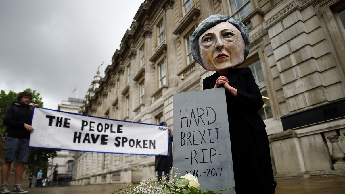 Protestor wearing a Theresa May mask is seen the day after Britain's election in London