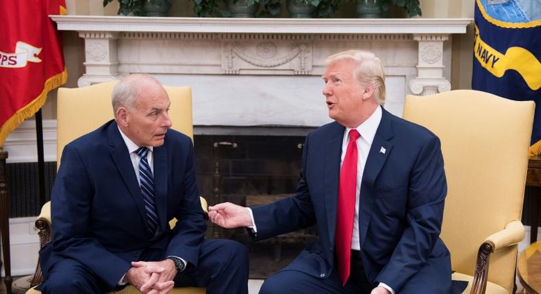 Outgoing White House Chief of Staff John Kelly, pictured with President Donald Trump in July 2017, told the Los Angeles Times that many migrants have been misled by traffickers