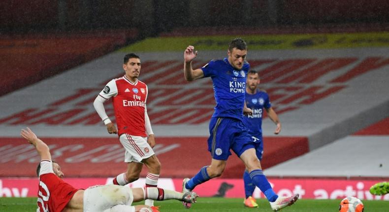 Fox in the box: Jamie Vardy (centre)salvaged a point for Leicester at Arsenal