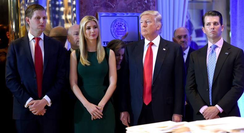 Donald Trump along with his children Eric(L) Ivanka and Donald Jr. arrive for a press conference January 11, 2017 at Trump Tower in New York.