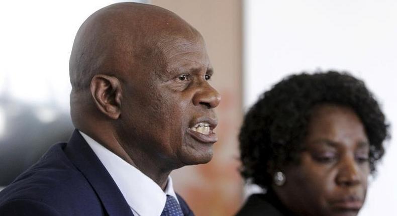 Zimbabwe's Finance Minister Patrick Chinamasa (L) addresses a media conference after meeting International Monetary Fund (IMF) Executive Director for Africa Chileshe Kapwepwe (R) in Harare, September 7, 2015. 