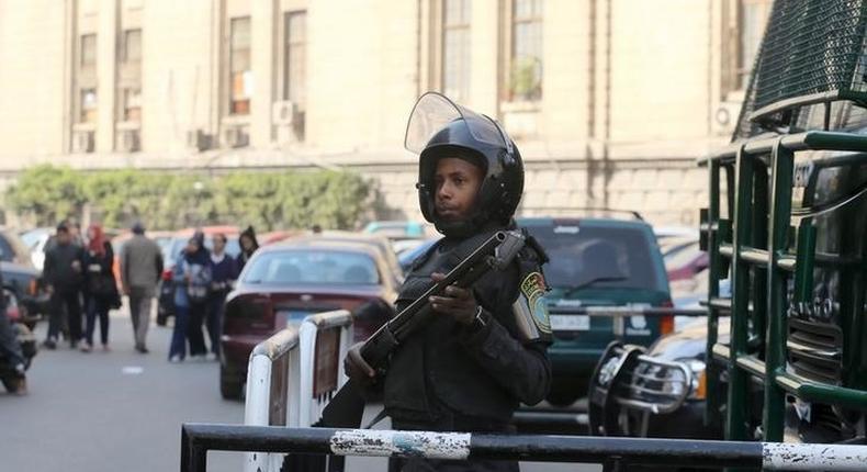 A member of the riot police stands guard outside the high court in Cairo, Egypt, January 21, 2016. REUTERS/Mohamed Abd El Ghany