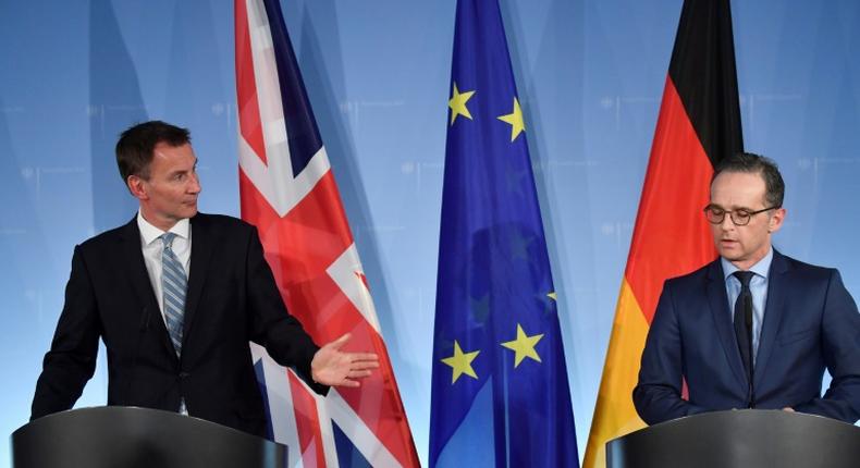 Britain's Foreign Secretary Jeremy Hunt (L) and German Foreign Minister Heiko Maas give a press conference following talks on February 20, 2019 in Berlin