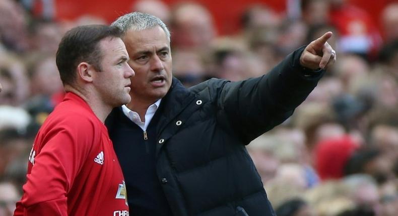 Jose Mourinho gives instructions to Wayne Rooney as he comes on as a substitute against Stoke City at Old Trafford on October 2, 2016