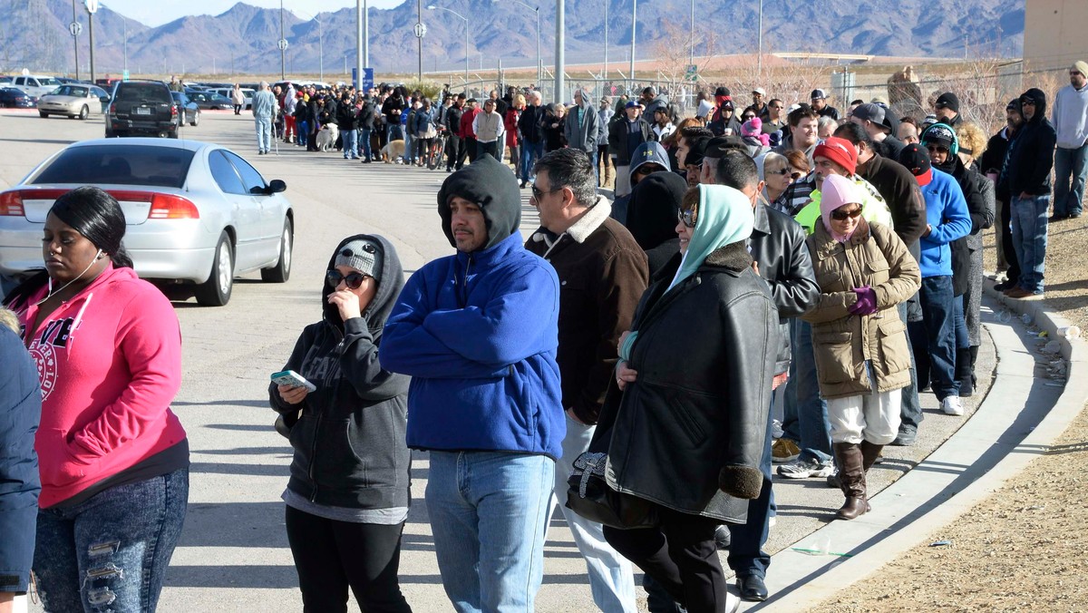 Hundreds of people wait in line to purchase tickets for the Powerball lottery at the CA lotto store in San Bernardino County, California