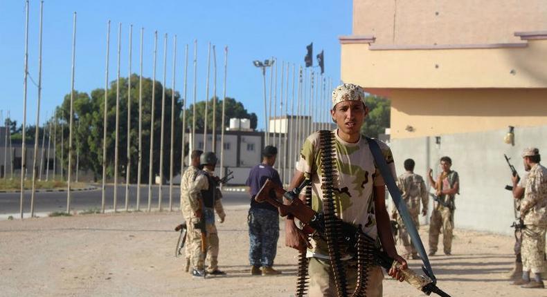 Soldiers from forces aligned with Libya's new unity government are seen on a road during an advance on the Islamic State stronghold of Sirte, June 8, 2016. 