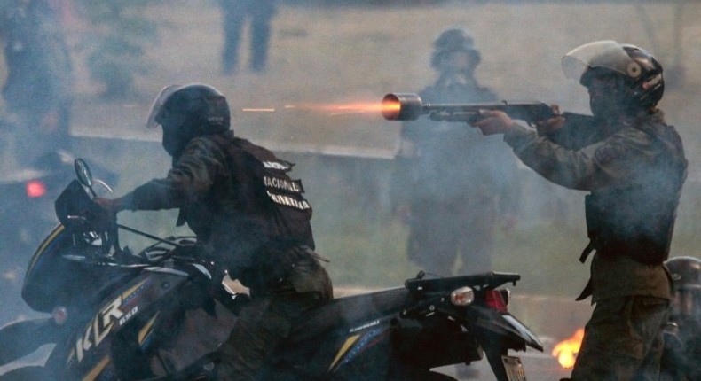 Bolivarian National Guard members shot rubber bullets at Venezuelan opposition demonstrators during a Thursday protest against President Nicolas Maduro