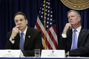 Andrew Cuomo (L) and New York Mayor Bill de Blasio