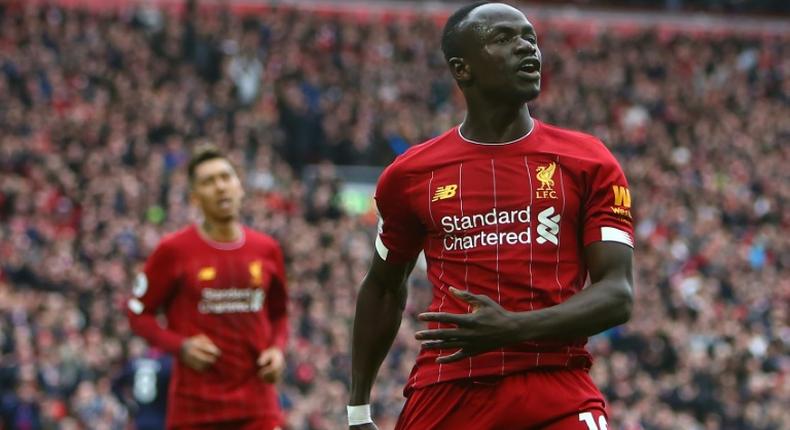Liverpool's Senegalese striker Sadio Mane (R) has donated $50000 US dollars to the Coronavirus fight in gis country