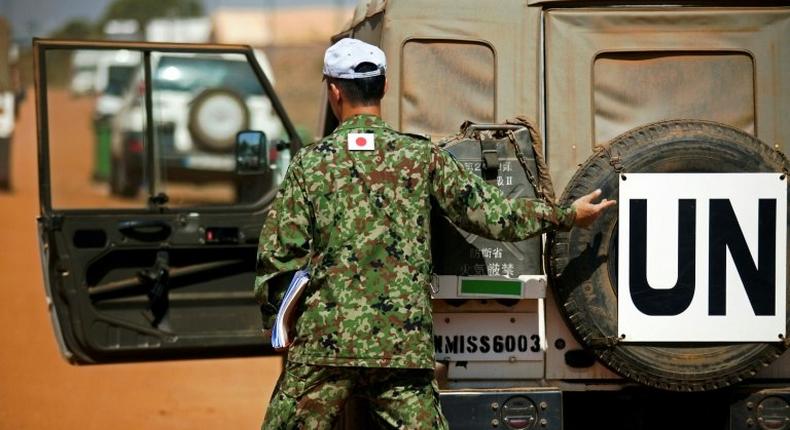 A member of the Japanese Ground Self-Defence Force (GSDF) prepares for the arrival of new troops at the compound of the United Nations peacekeeping mission (UNMISS) in Juba, South Sudan on November 21, 2016