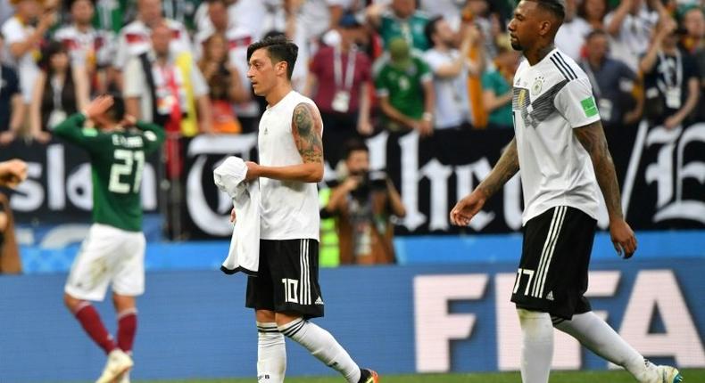 Mesut Ozil (L) took to Instagram to thank his former Germany team-mate defender Jerome Boateng (R) for publically supporting him in the wake of the Arsenal midfielder's controversial retirement from international football.