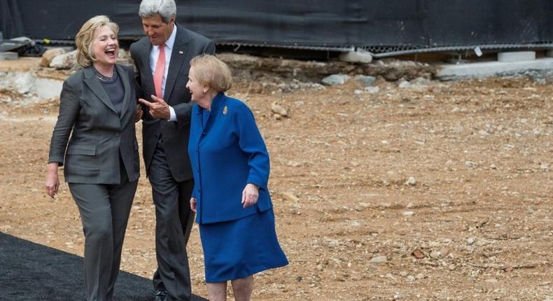 Then US Secretary of State John Kerry (C) talks with former US Secretaries of State Hillary Clinton (L) and Madeleine Albright (R) after breaking ground at the US Diplomacy Center at the US State Department in Washington, DC, September 3, 2014