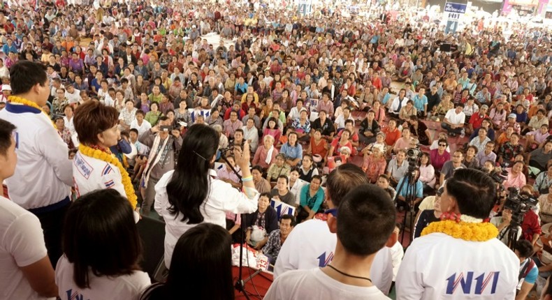 Thousands of Thais loyal to ex-premier Thaksin Shinawatra gather for a political rally in rural Chaiyaphum