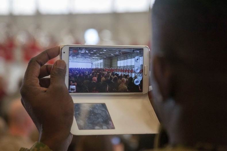 A Marine records a Drum and Bugle Corps performance at Marine Corps Air Station Beaufort in March 2014.US Marine Corps/Lance Cpl. Patrick J. McMahon