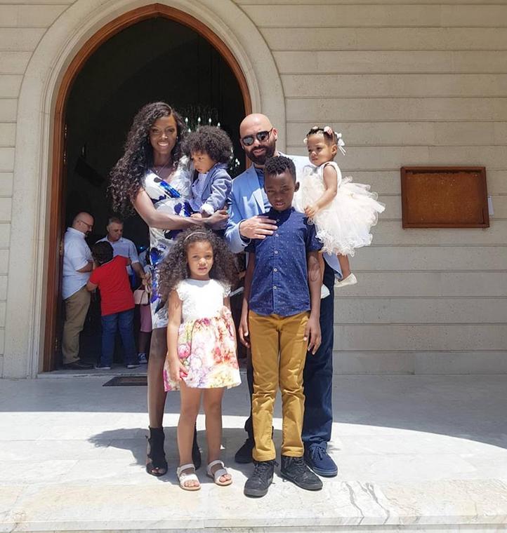 Dorah Mwima with her children and husband 