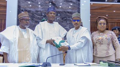 Minister of Education, Prof. Tahir Mamman, receiving the report of an inter-ministerial committee on Friday.  [Twitter:@ProfTahirMamman]