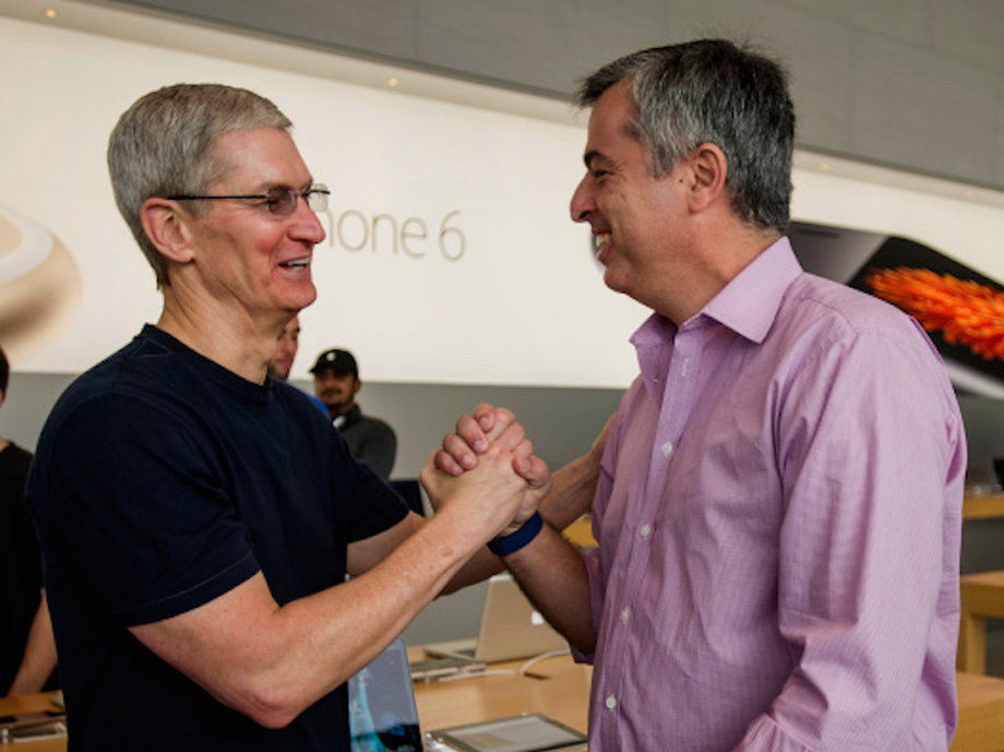 Tim Cook and Eddy Cue, senior vice president of internet software and services at Apple, during the sales launch for the iPhone 6 and iPhone 6 Plus at the Apple Inc. store in Palo Alto, California, U.S., in 2014.