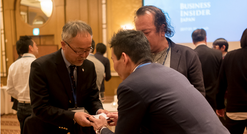 Two Japanese businessmen exchange