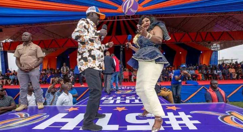 Raila Odinga dances with Congolese Rhumba singer Mbilia Bel during an Azimio rally at Bukhungu Stadium in Kakamega County on July 9, 2022