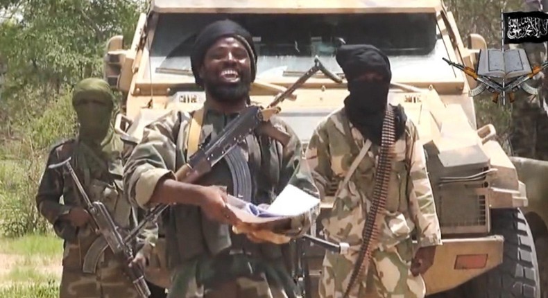 Boko Haram leader, Abubakar Shekau flanked by fellow terrorists.