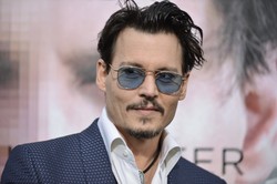 Johnny Depp czaruje jak Harry Houdini