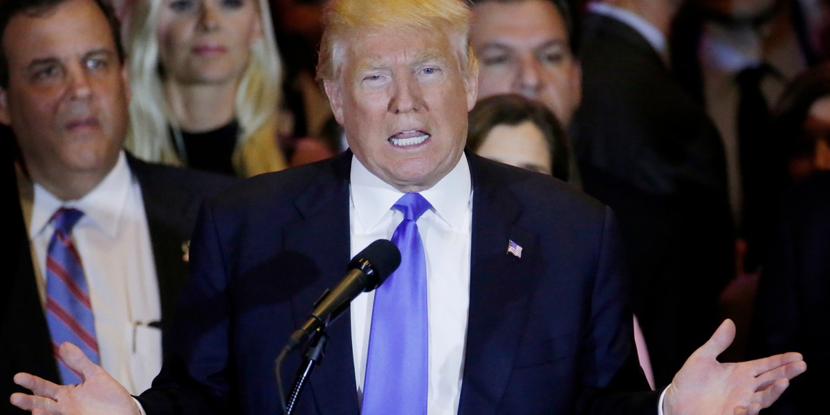 Republican US presidential candidate and businessman Donald Trump speaks to supporters as New Jersey Gov. Chris Christie looks on during Trump's five-state primary night rally at Trump Tower in Manhattan, New York, on April 26.