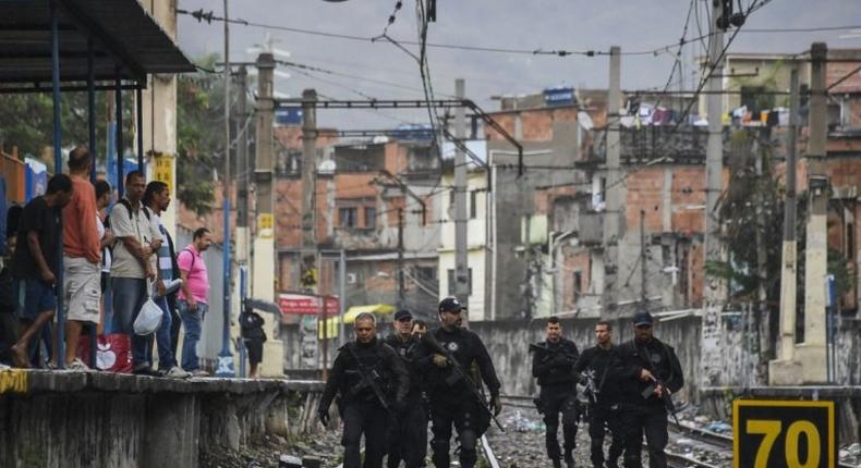 Rio police, shown here carrying out a pre-dawn crackdown on drug gangs in a favela, are demoralized and struggling to contain violence