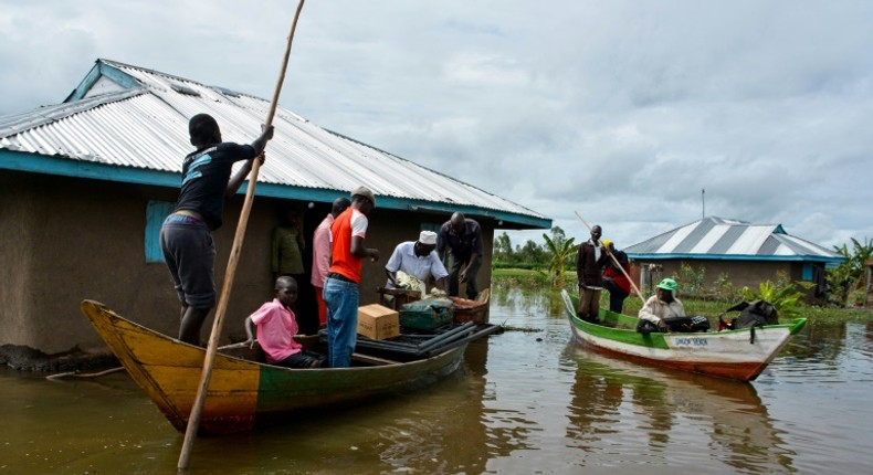 Rescue boats evacuate families after their houses were flooded in Kenya