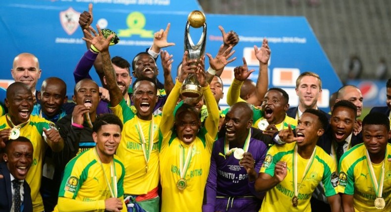 Mamelodi Sundowns' players celebrate after winning the CAF Champions League competition following their final match against Egypt's Zamalek, at the Borg el-Arab Stadium near Alexandria, on October 23, 2016