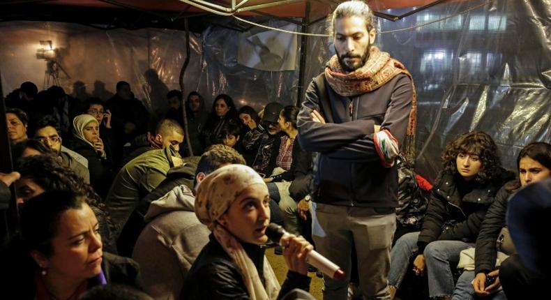 Young Lebanese discuss the protest-ridden country's political future in an impromptu debating chamber set up in a tent in second city Tripoli