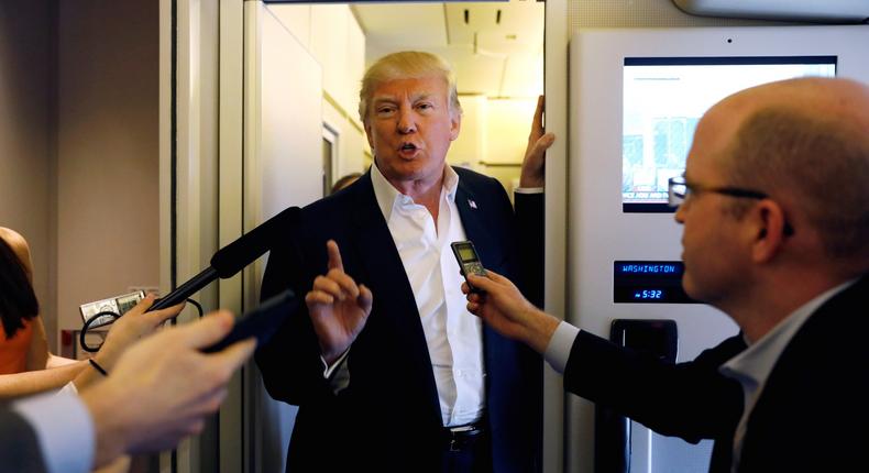 President Donald Trump with reporters on Air Force One on Saturday.