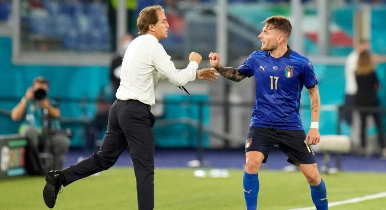 Ciro Immobile (R) celebrates Italy's third goal with coach Roberto Mancini Creator: Alessandra Tarantino