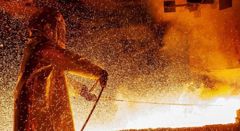 A worker manning a furnace during the nickel smelting process