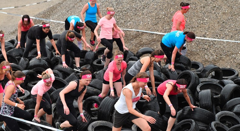 People participating in an event called Muddy Angel Run in Munich.