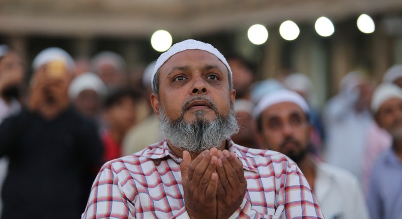 A Muslim man prays as he and others assemble to spot the crescent moon, on the eve of the holy fasting month of Ramadan at a mosque in Ahmedabad, India, May 6, 2019.