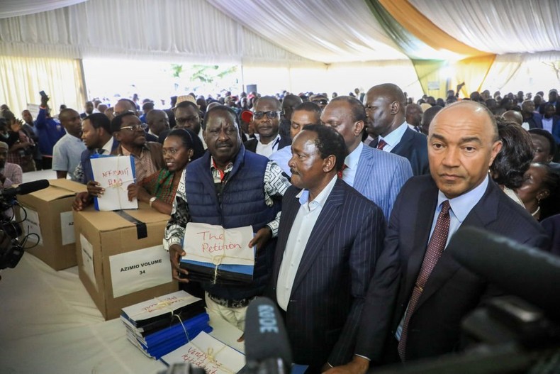 NAIROBI, KENYA - Azimio la Umoja One Kenya coalition presidential candidate Raila Odinga (C) and his running mate Martha Karua (4th from R) hand over their petition at the Supreme Court Sub-Registry offices in Milimani Law Courts challenging the presidential election results. (Photo by John Ochieng/SOPA Images/LightRocket via Getty Images)