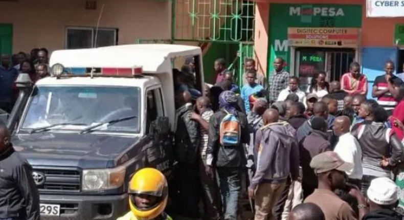 File image of a crowd at a crime scene